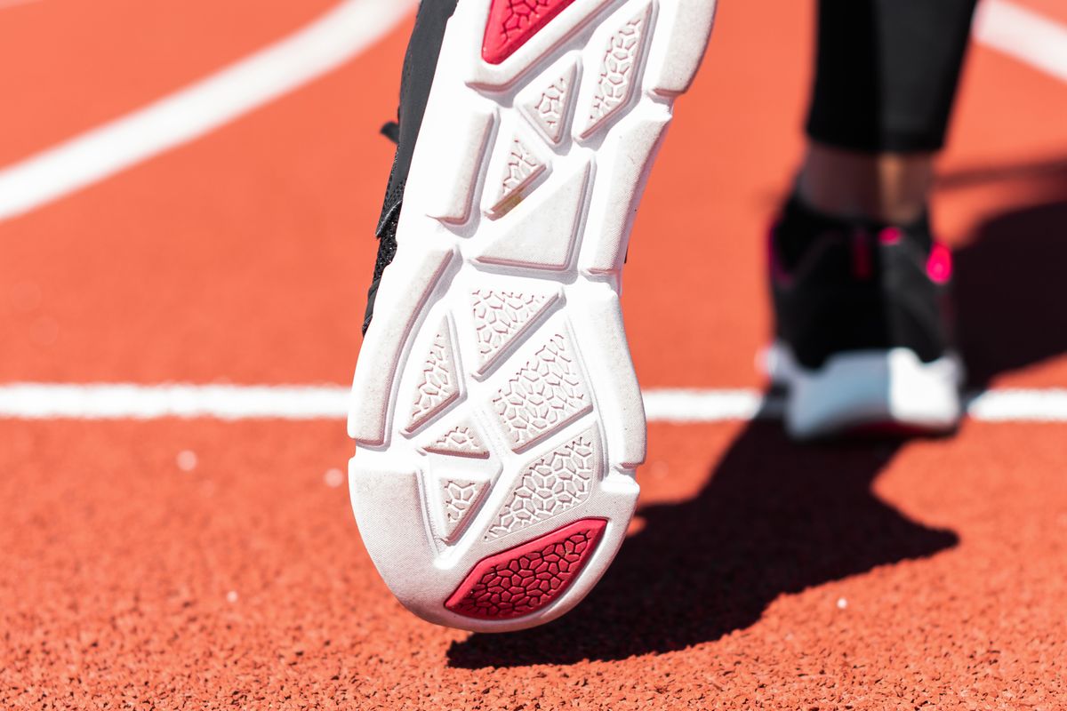 The sole of a running shoe seen from below