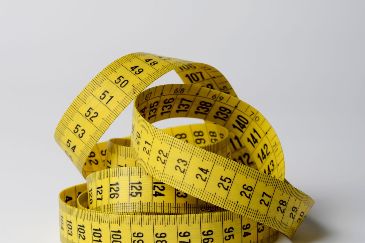 Close-up of a yellow tailor's tape measure